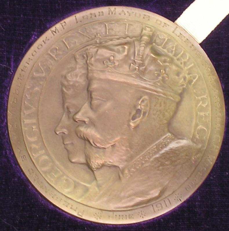 MINT CASED 1911 CORONATION MEDALLION, PRESENTED TO ALDERMAN C.H.WILSON OF LEEDS, THE ORIGINAL QUARTERMASTER OF THE LEEDS PALS 1914
